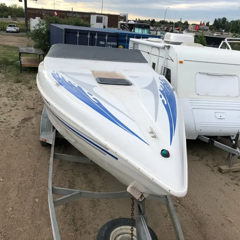 A small boat with blue water graphics on the top