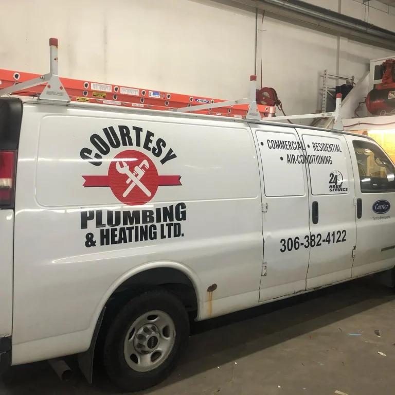 A work van with logo and lettering on the side.