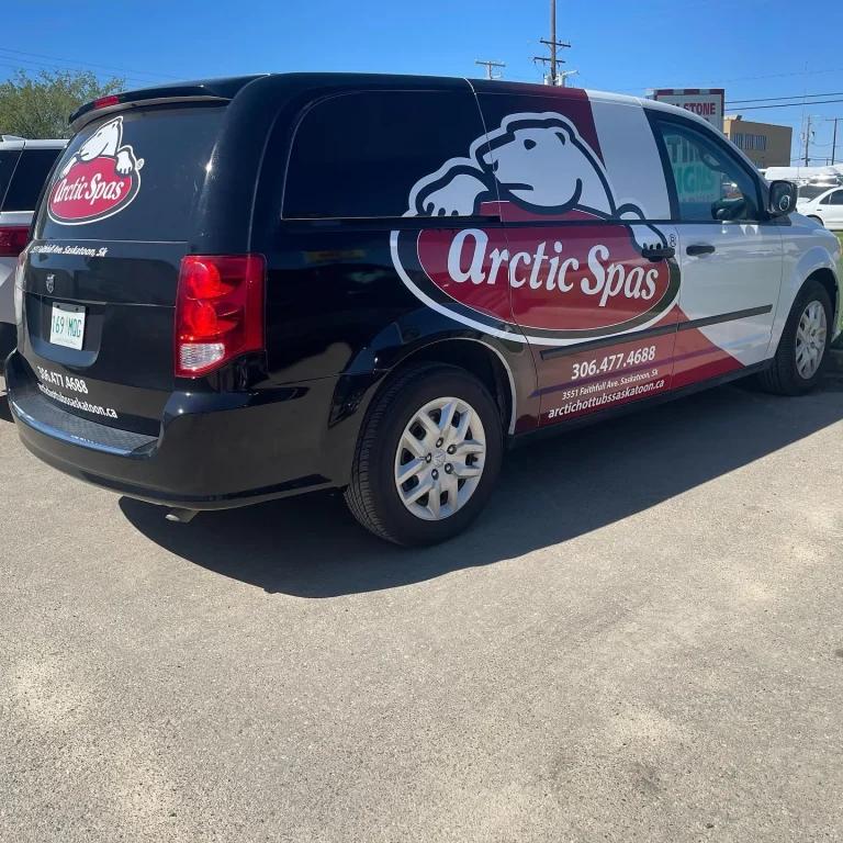 A van with custom graphics and company logo on the side and rear window.