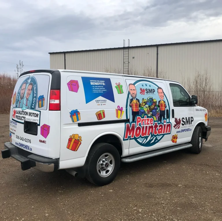 A white van with company logos and messaging on the side and rear.