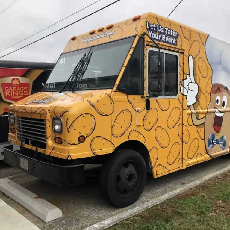 A food truck wrapped in yellow themed potato wrap.