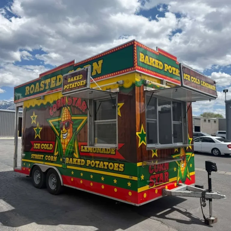 A food stand trailer selling roasted potatoes wrapped in custom vinyl graphics