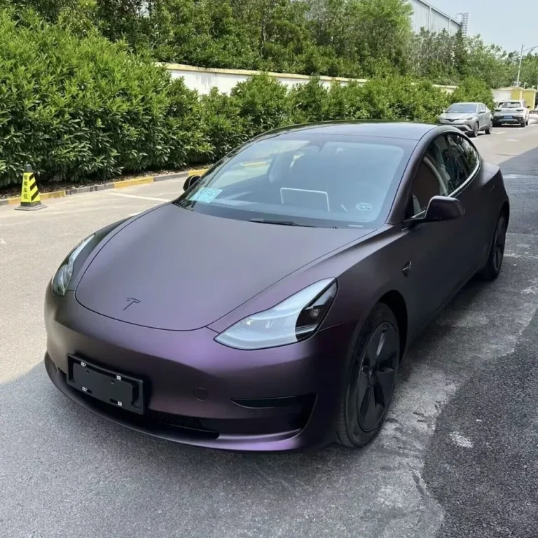 A Tesla wrapped in deep purple matte wrap.