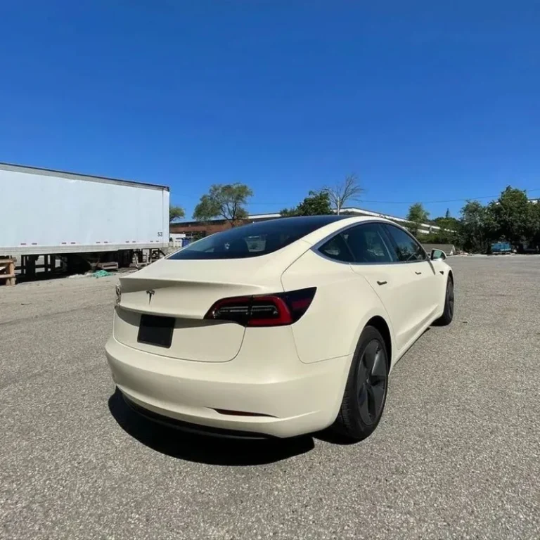 A Tesla wrapped in white matte vinyl.