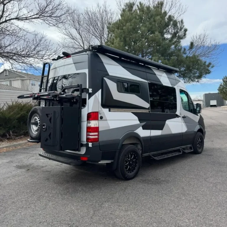 A small van motorhome with custom wrapped design.