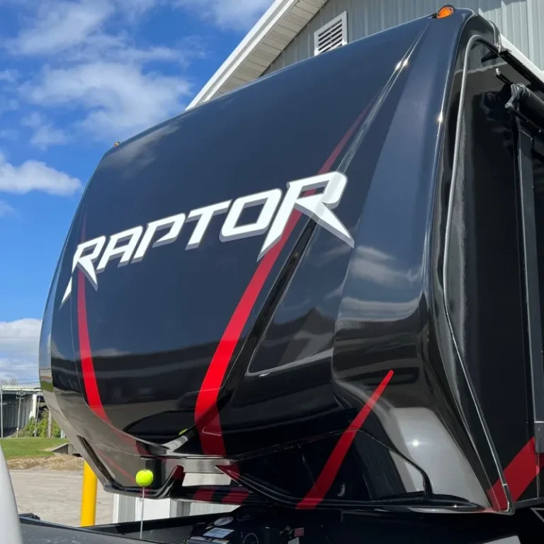 A trailer with the word Raptor on the front end.