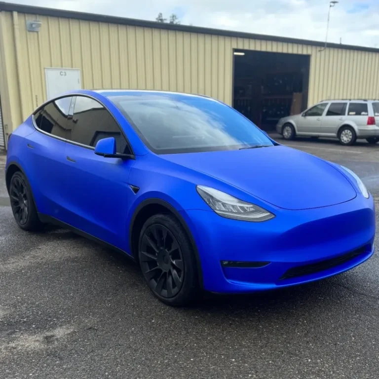 A Tesla with satin blue vinyl wrapped.