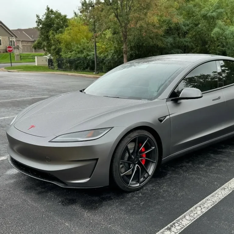 Tesla wrapped in dark grey vinyl.