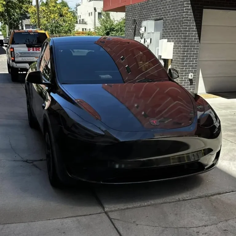 Tesla wrapped in shiny black vinyl.