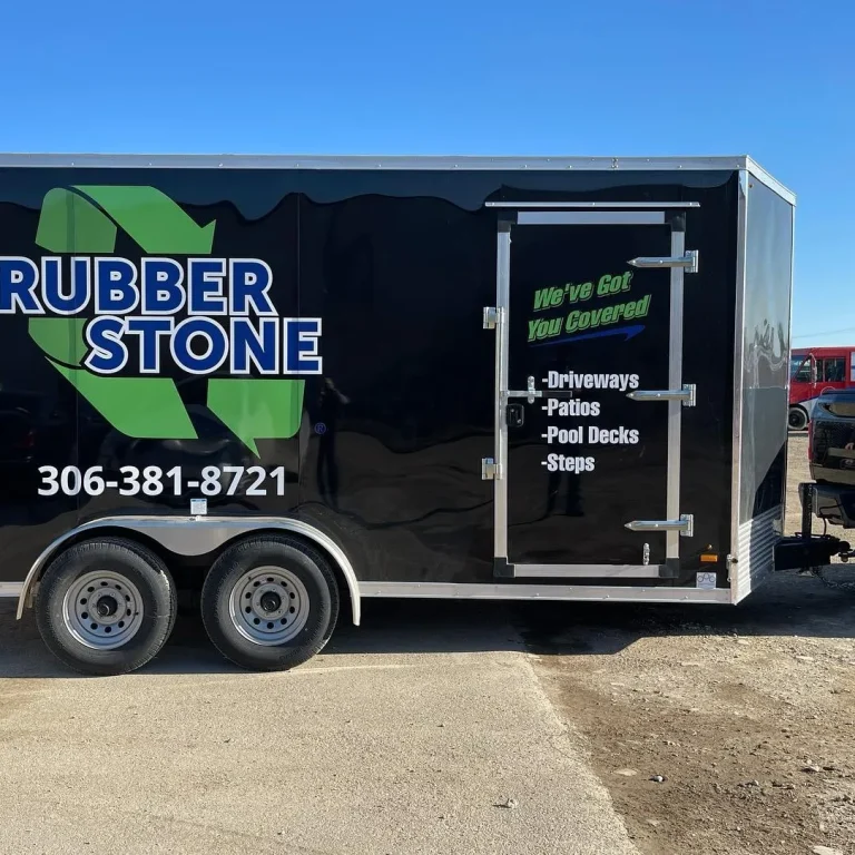 A trailer wrapped in black with company logo and number.