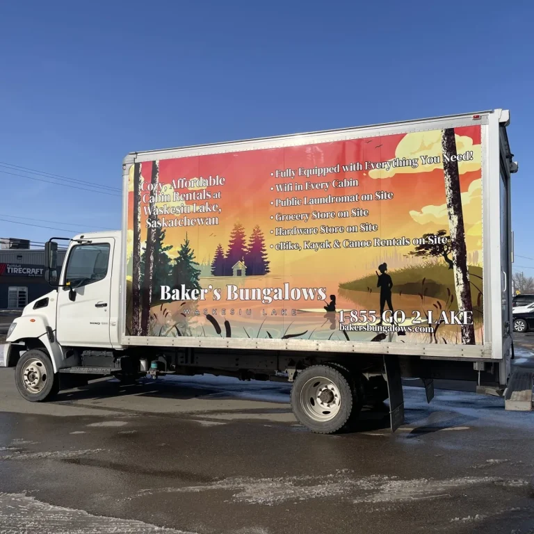 A box truck with full wrapped graphics on the side of the box.