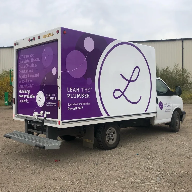 A box truck with graphics and company logo.