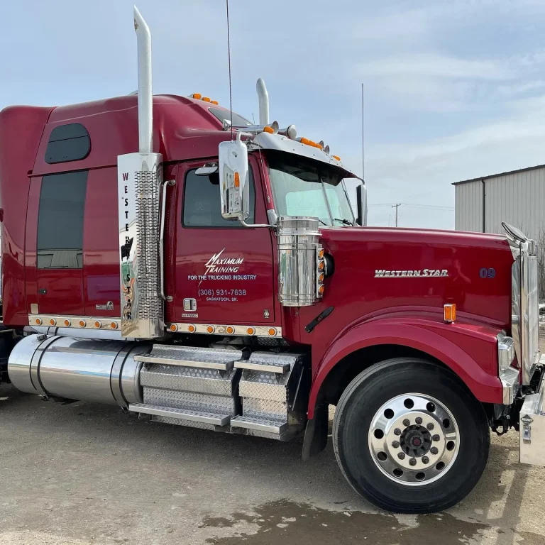 A red semi truck cab with custom lettering.