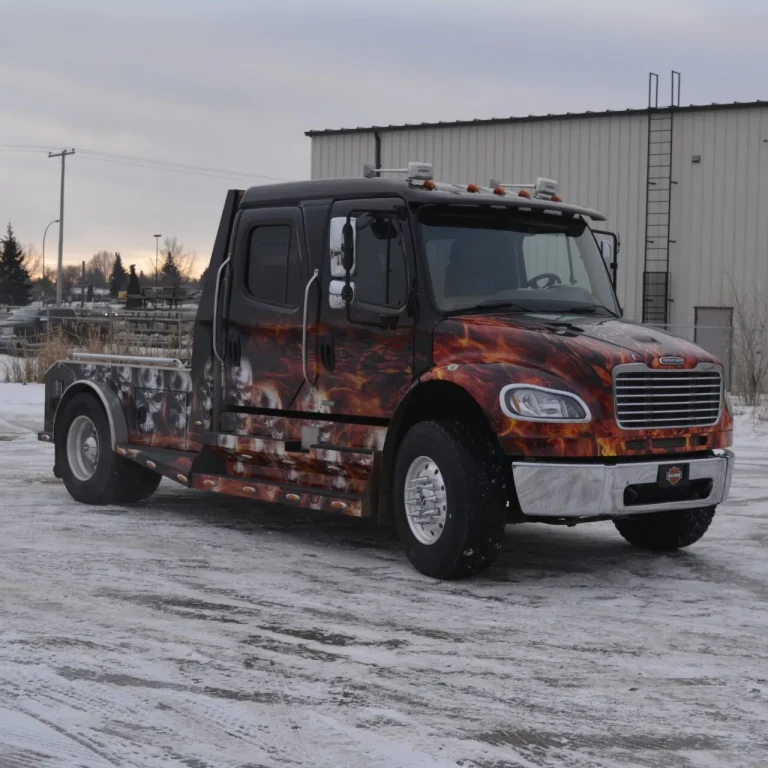 A large truck with custom wrapped graphics.