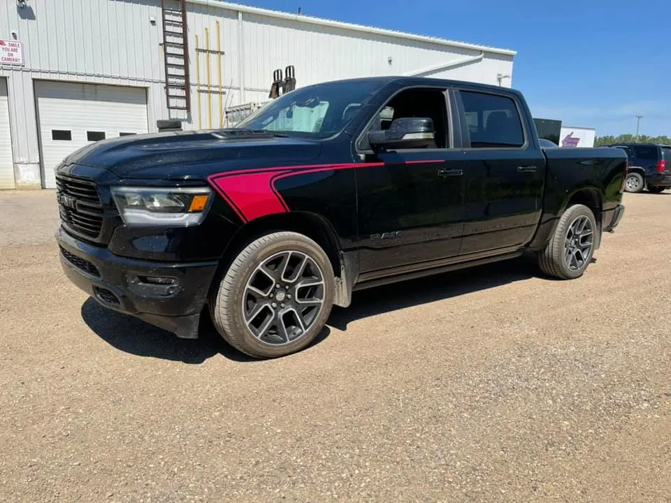 A black truck with red accent vinyl.