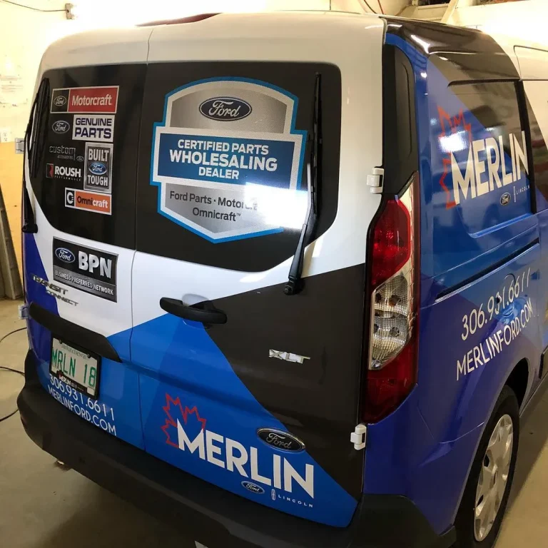 A van with vinyl wrapped rear.